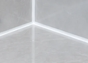 After: fresh white silicone in the same shower corner